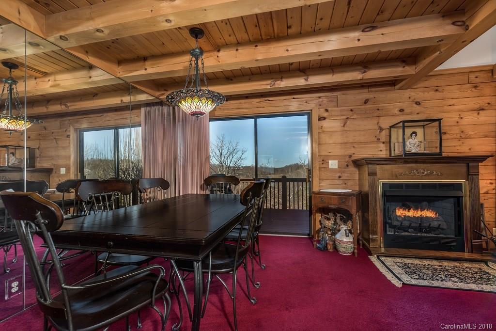 2141 Coxe Road, Unit 96 Rutherfordton, NC 28139 - Photo 8 of 25 a dining room with furniture and a fireplace