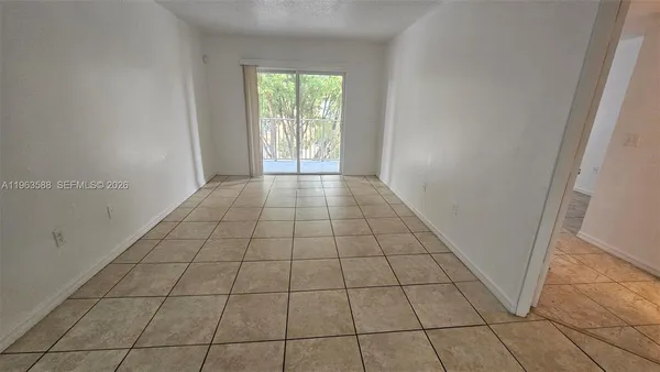 a view of an empty room and window
