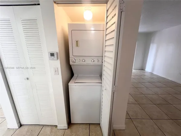 a view of bathroom with a washer and dryer