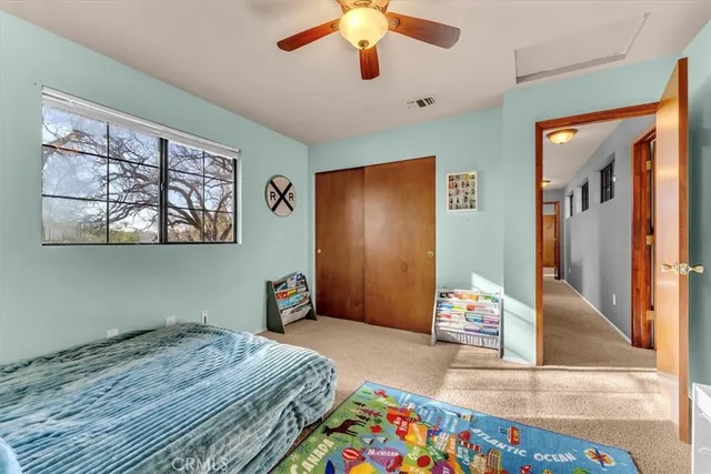 a living room with lots of furniture and a flat screen tv