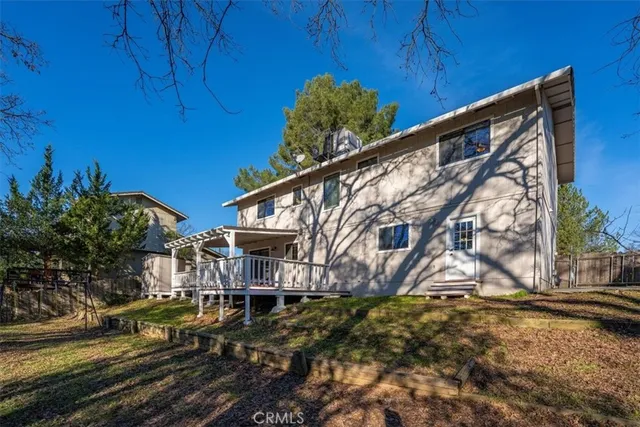 a view of road and house in background
