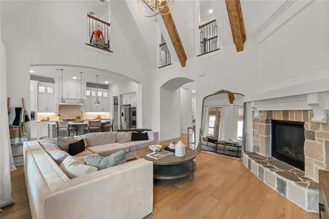 a living room with fireplace furniture and a flat screen tv