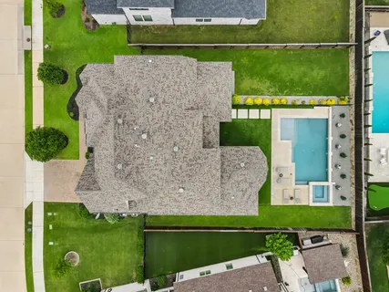 an aerial view of a house with a garden