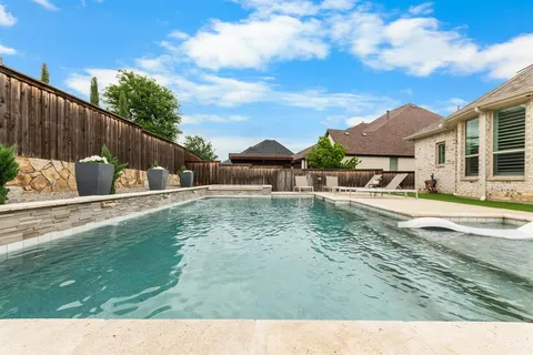 a front view of house with yard and outdoor seating