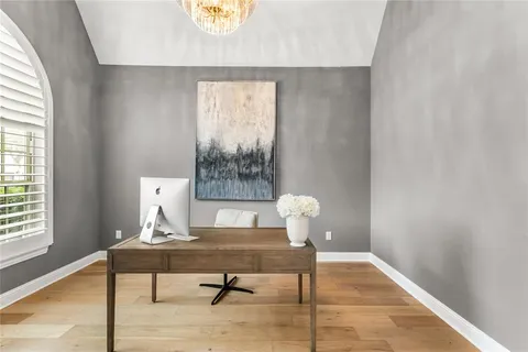 a living room with a table and a window