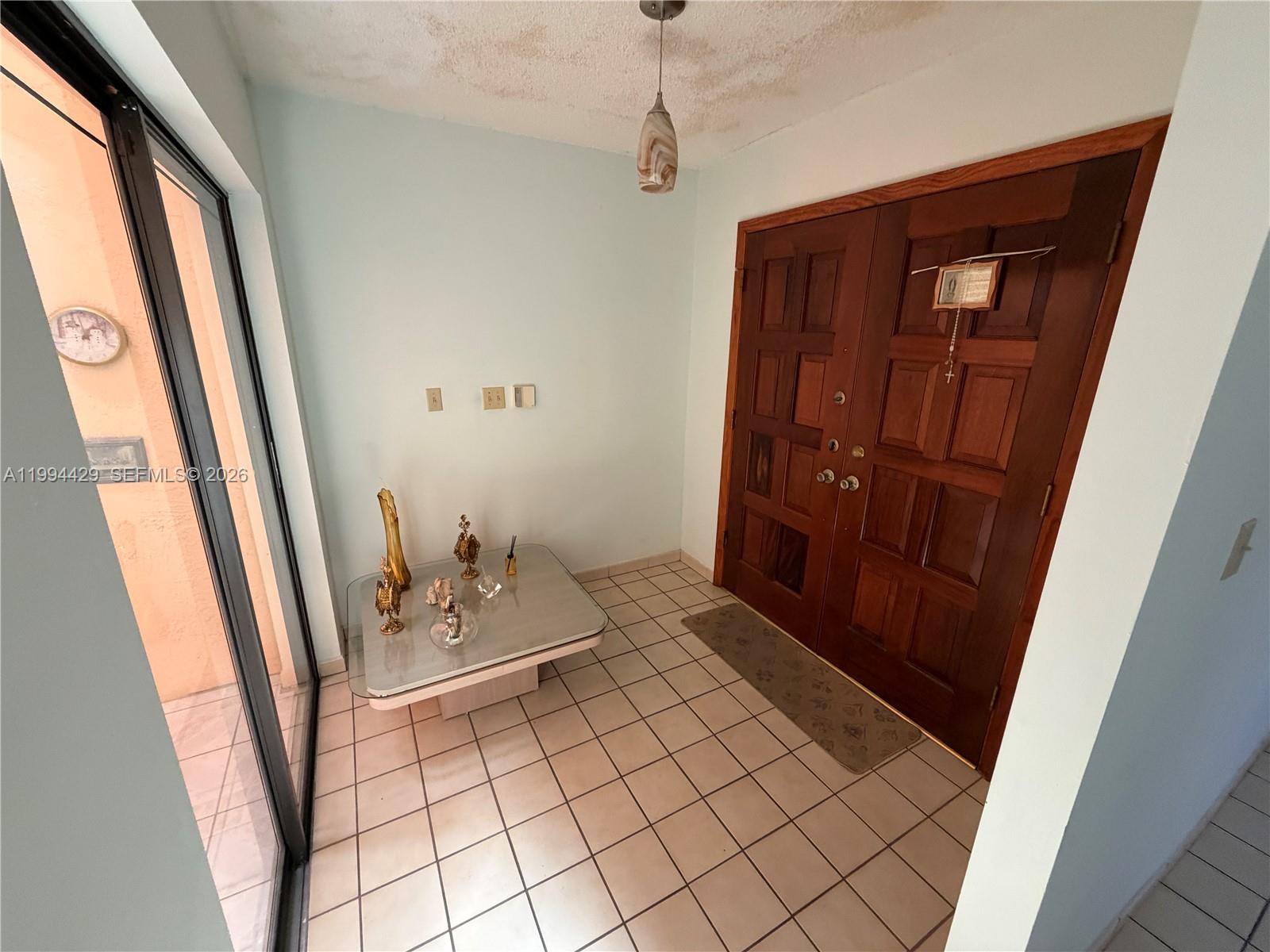 13470 Southwest 27th Street Miami, FL 33175 - Photo 4 of 11 a bathroom with a sink a mirror and vanity