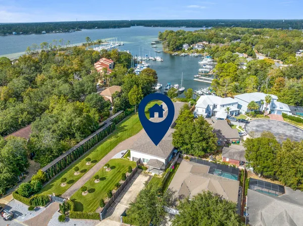 an aerial view of a house with a lake view