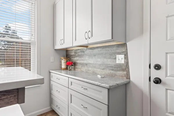 a view of cabinets with wooden floor