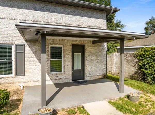 a front view of a house with a porch