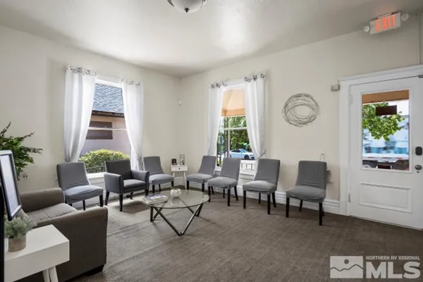 a living room with furniture and window