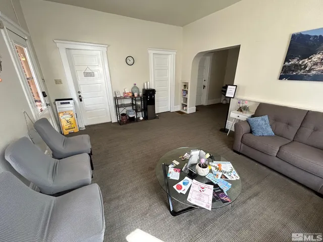 a living room with furniture and a couch