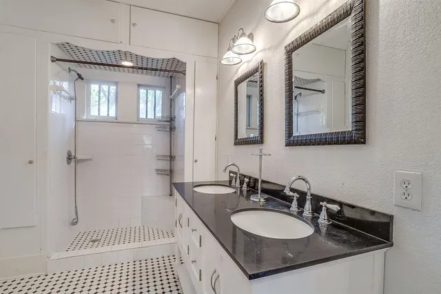 a bathroom with a sink a vanity and a mirror