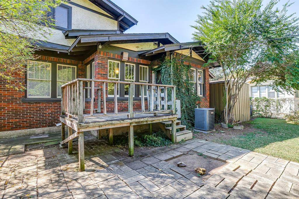 2312 Mistletoe Avenue Fort Worth, TX 76110 - Photo 40 of 40 a view of a chair and table in backyard of the house