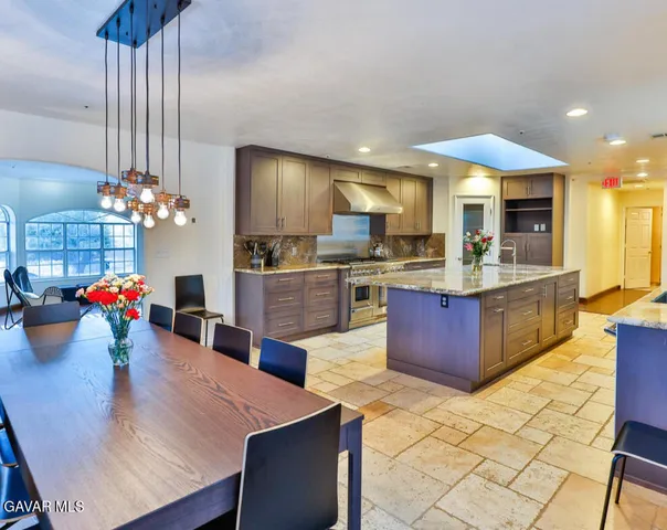 a kitchen with a refrigerator and a sink