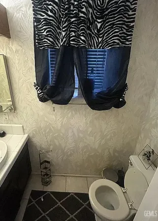 a bathroom with a sink and a toilet