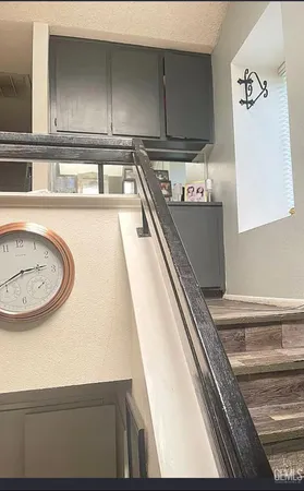 a kitchen with a sink and a refrigerator