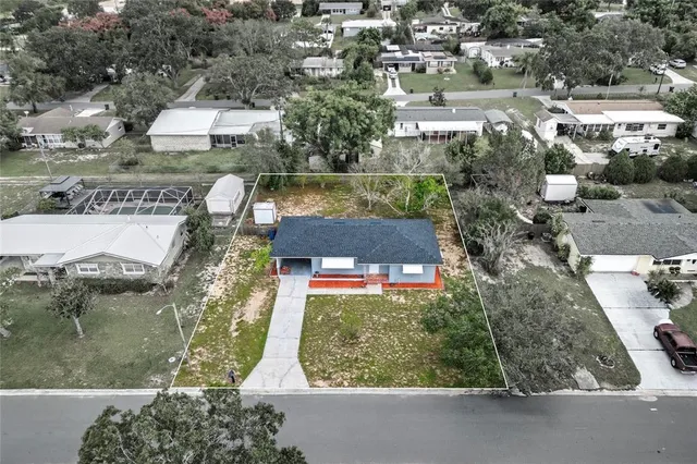 an aerial view of house with yard