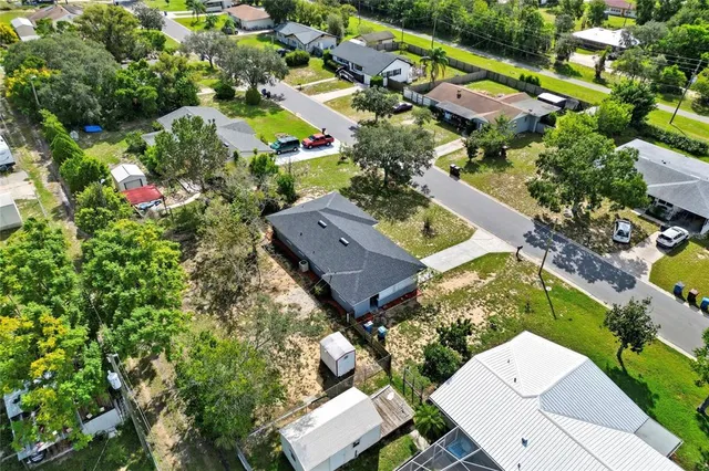 an aerial view of a house with a garden
