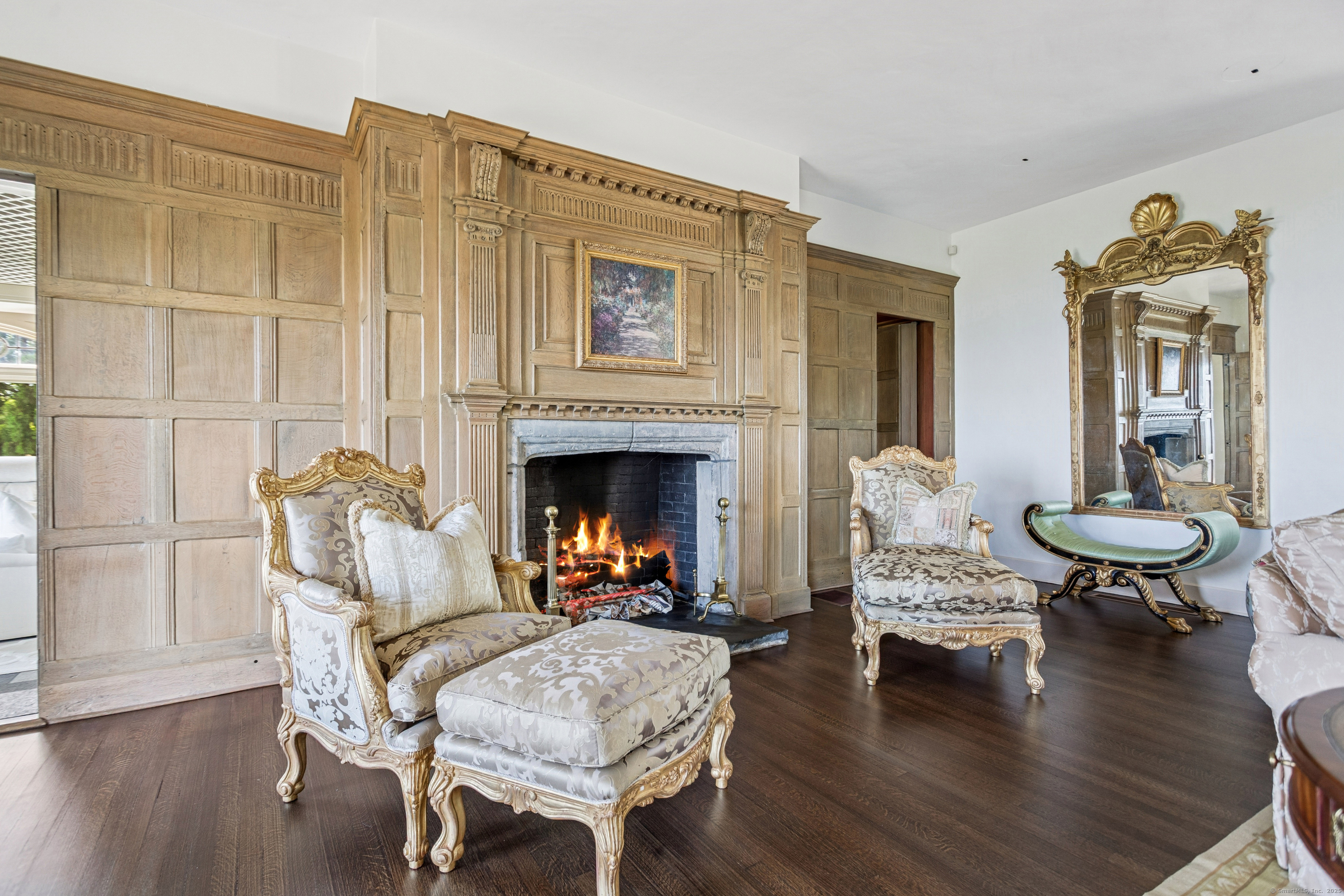 92 Beachside Avenue Westport, CT 06880 - Photo 12 of 28 a living room with furniture a fireplace and wooden floor