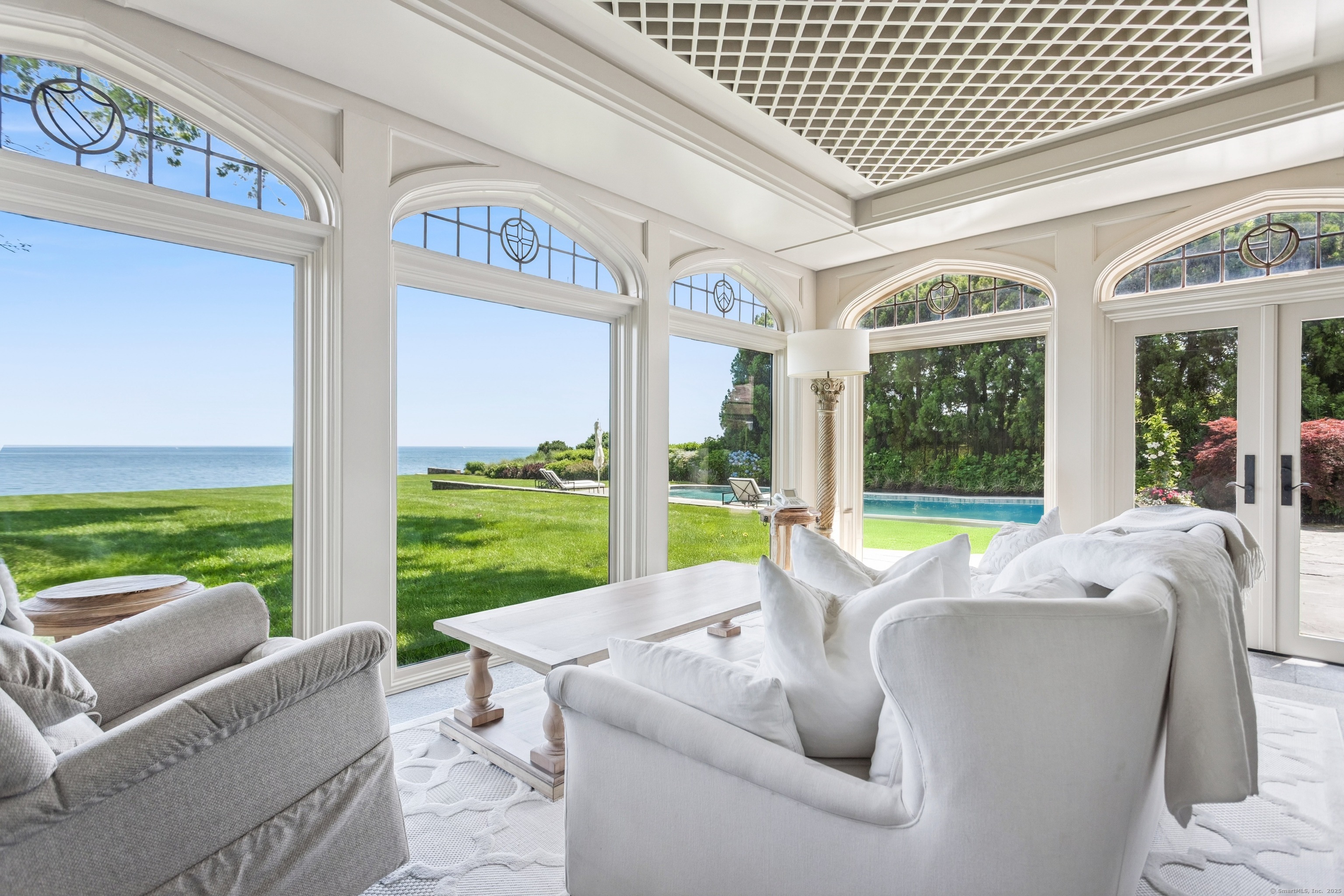 92 Beachside Avenue Westport, CT 06880 - Photo 14 of 28 a living room with patio floor and a floor to ceiling window