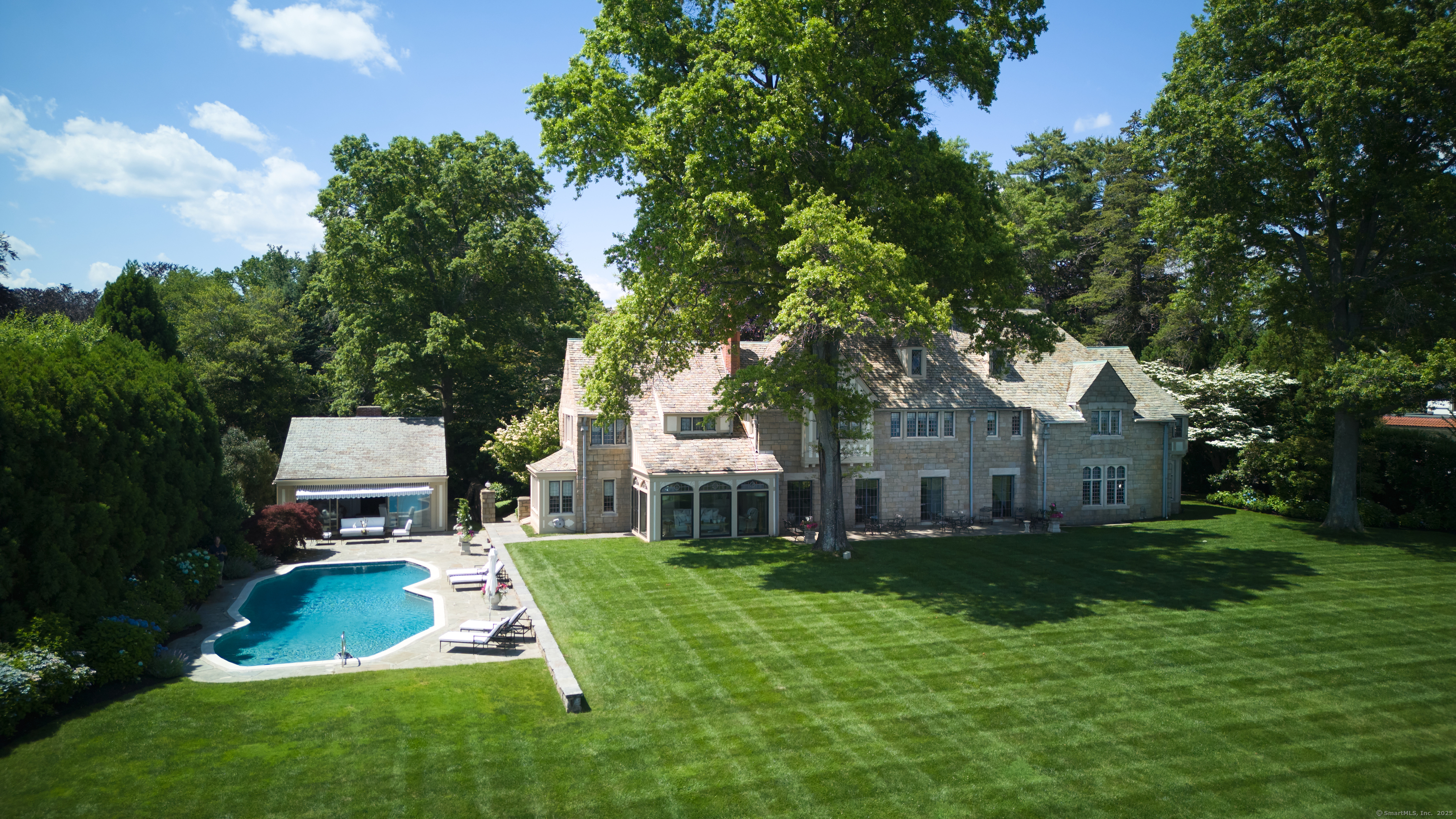 92 Beachside Avenue Westport, CT 06880 - Photo 19 of 28 a front view of a house with a yard
