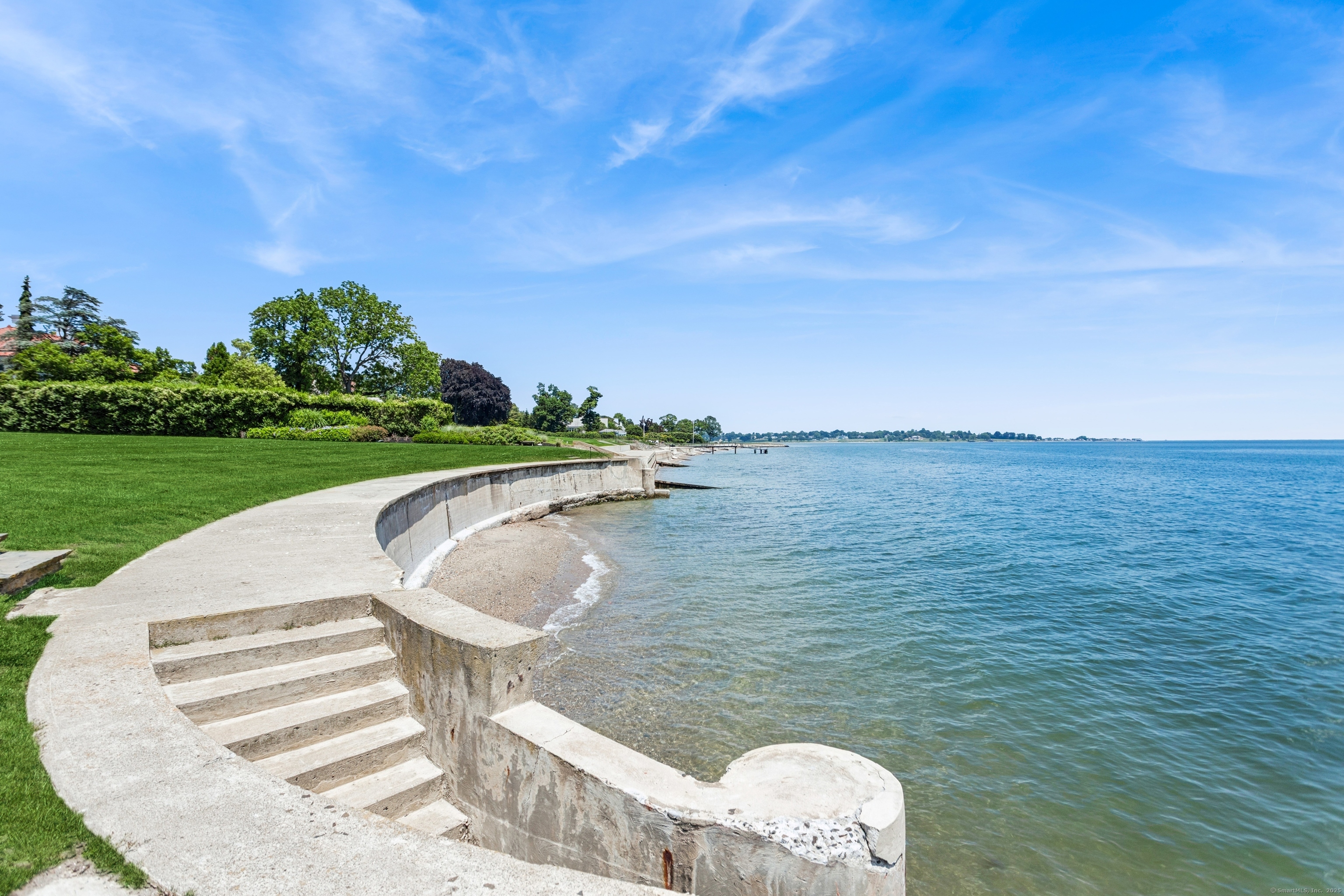 92 Beachside Avenue Westport, CT 06880 - Photo 26 of 28 a view of a swimming pool and lake in the background