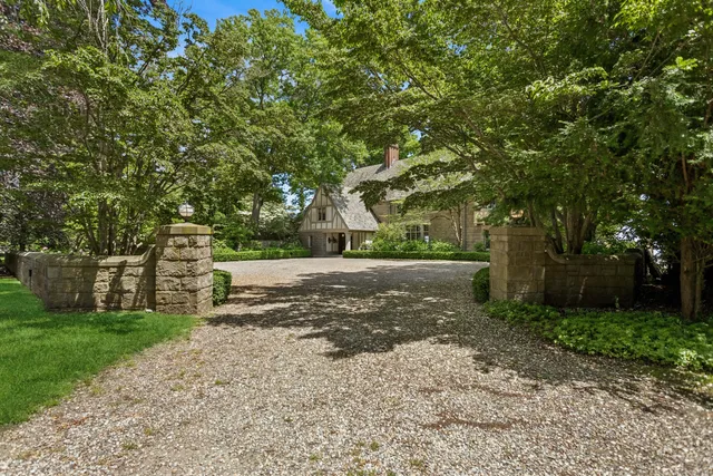 a view of a tree in front of a house