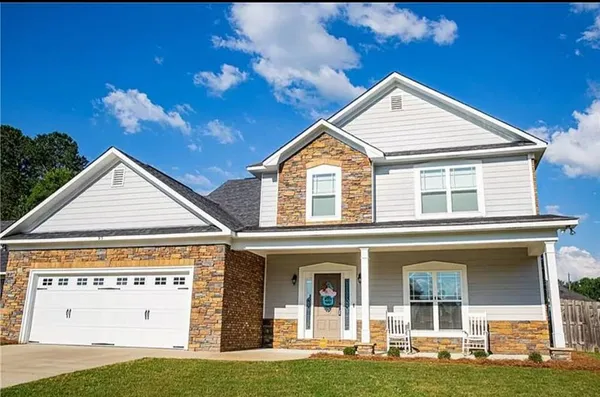 a view of a house with a yard