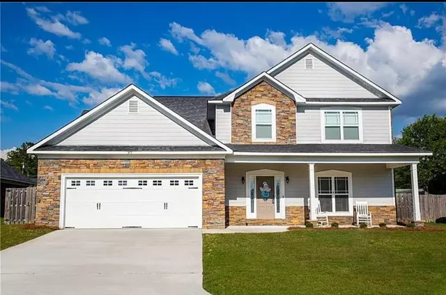 front view of a house with a yard