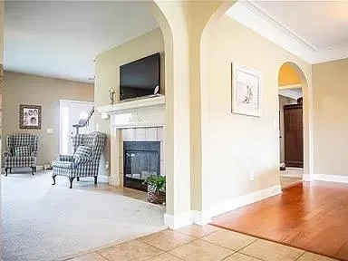 a living room with furniture and a flat screen tv