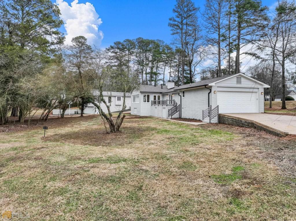 172 Thompson Place Gainesville, GA 30506 - Photo 18 of 32 a view of a house with a yard