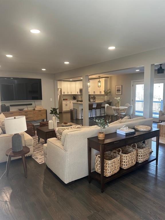 172 Thompson Place Gainesville, GA 30506 - Photo 5 of 15 a living room with furniture a flat screen tv and a large window
