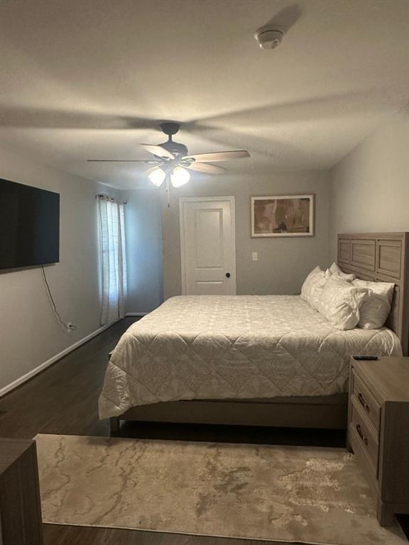 172 Thompson Place Gainesville, GA 30506 - Photo 8 of 15 a spacious bedroom with a bed and a flat screen tv