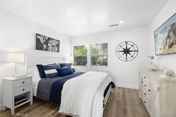 a bedroom with a large bed and a window