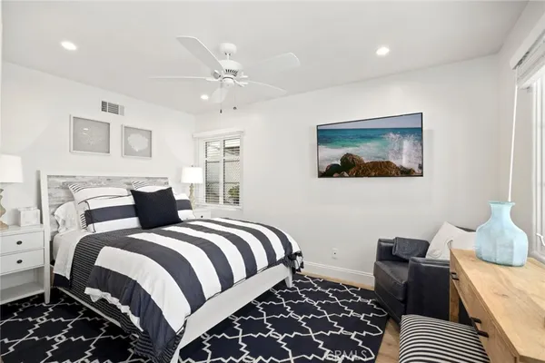 a bedroom with bed and a window