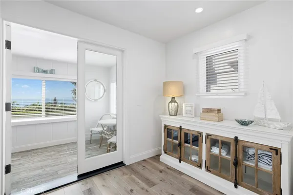 a kitchen with stainless steel appliances granite countertop a stove a sink and a granite counter tops with white cabinets