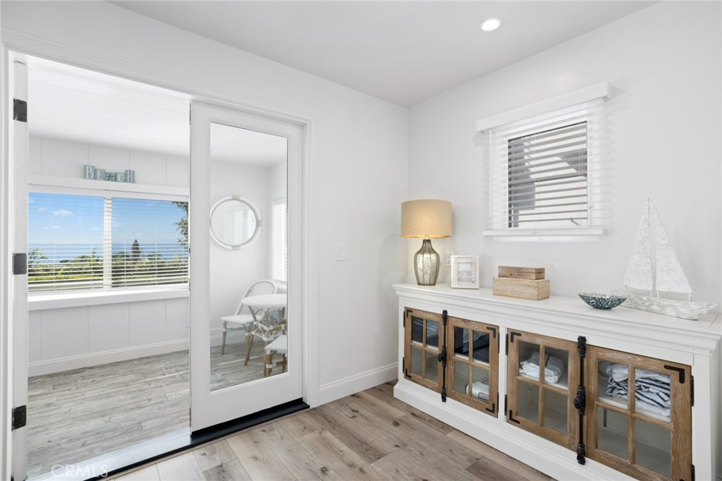2915 Rounsevel Terrace Laguna Beach, CA 92651 - Photo 18 of 32 a kitchen with stainless steel appliances granite countertop a stove a sink and a granite counter tops with white cabinets