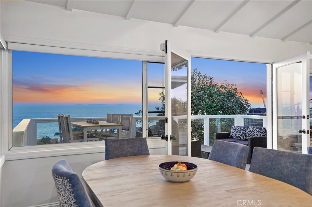 2915 Rounsevel Terrace Laguna Beach, CA 92651 - Photo 23 of 32 a kitchen with a table chairs and a view of living room