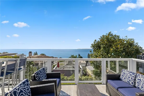 a view of a balcony with furniture