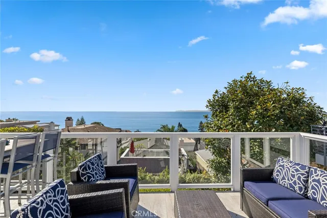 a view of a balcony with furniture