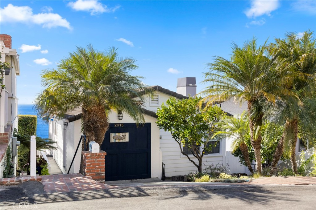 2915 Rounsevel Terrace Laguna Beach, CA 92651 - Photo 32 of 32 a front view of a house with a yard