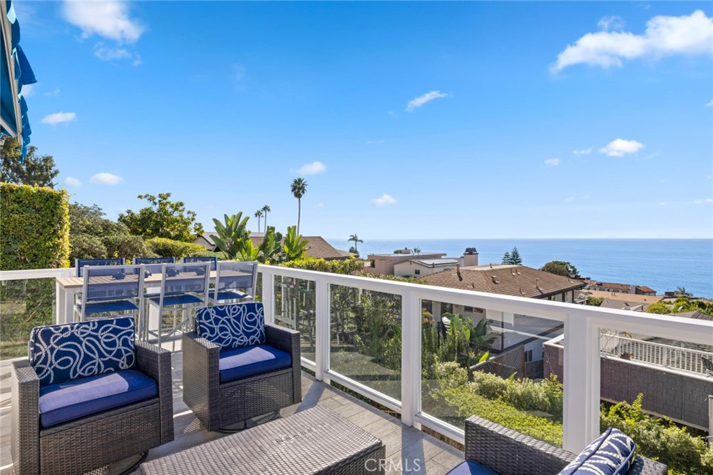 2915 Rounsevel Terrace Laguna Beach, CA 92651 - Photo 4 of 32 a view of a balcony with chairs and a potted plant