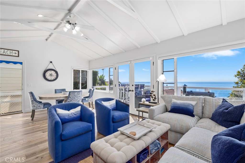 2915 Rounsevel Terrace Laguna Beach, CA 92651 - Photo 8 of 32 a living room with furniture kitchen view and a large window