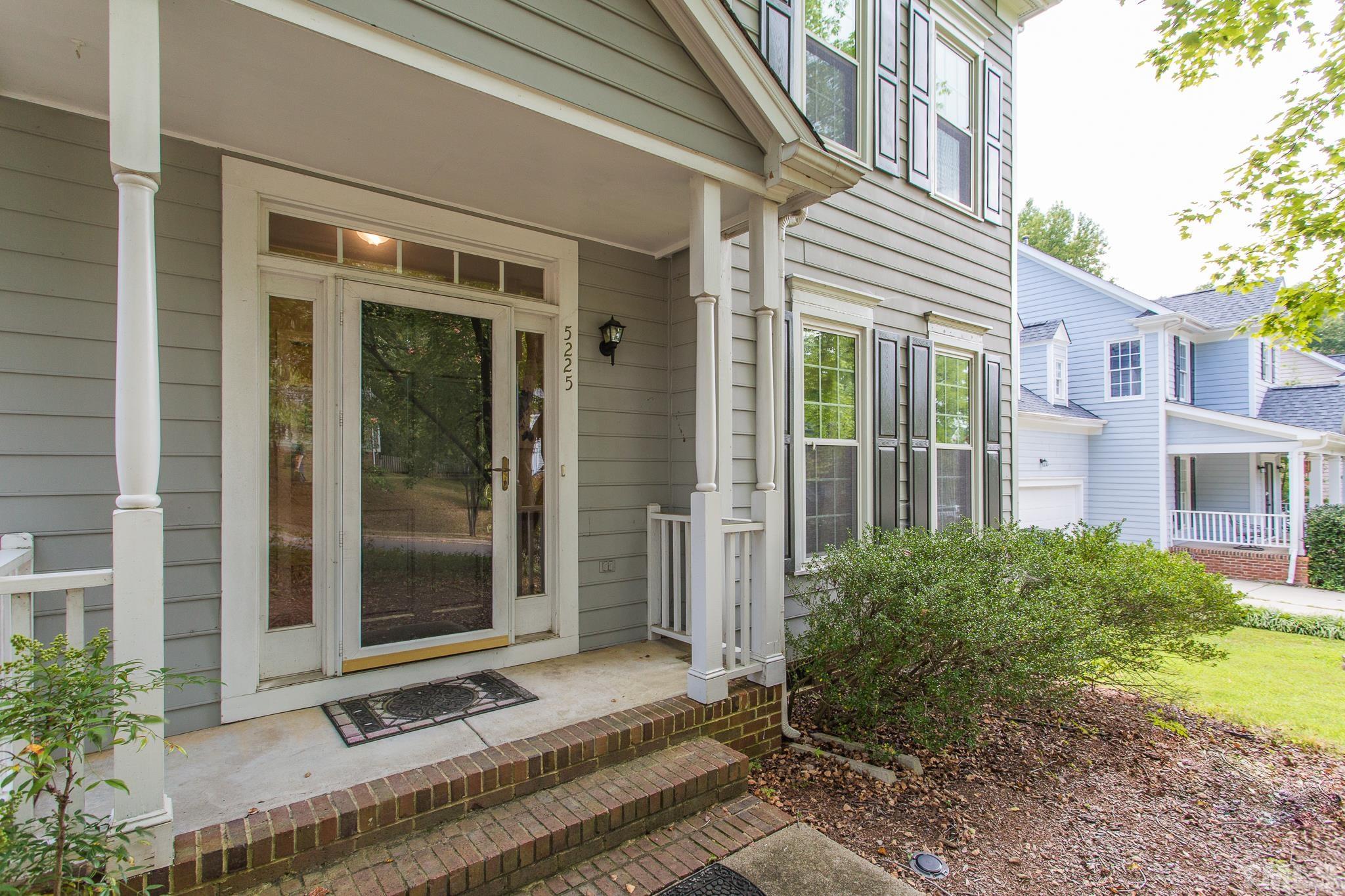 5225 Covington Bend Drive Raleigh, NC 27613 - Photo 2 of 30 a front view of a building with a garden
