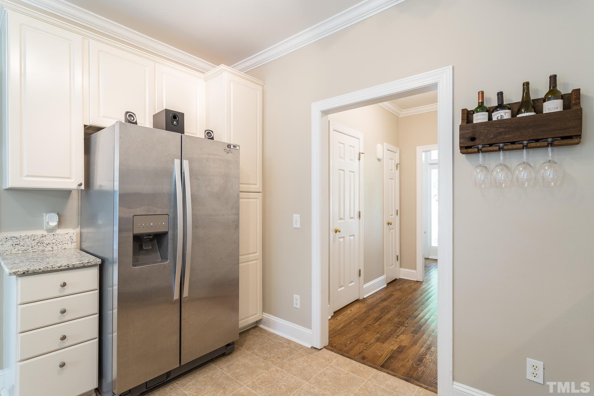 5225 Covington Bend Drive Raleigh, NC 27613 - Photo 15 of 30 a view of a refrigerator in kitchen and living room