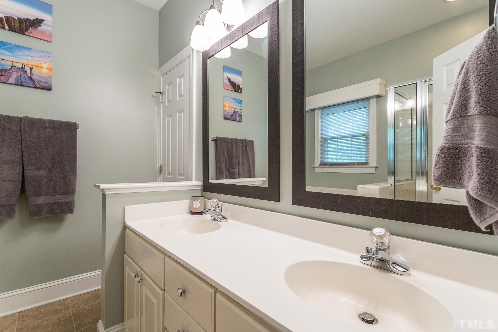5225 Covington Bend Drive Raleigh, NC 27613 - Photo 21 of 30 a bathroom with a sink and a mirror