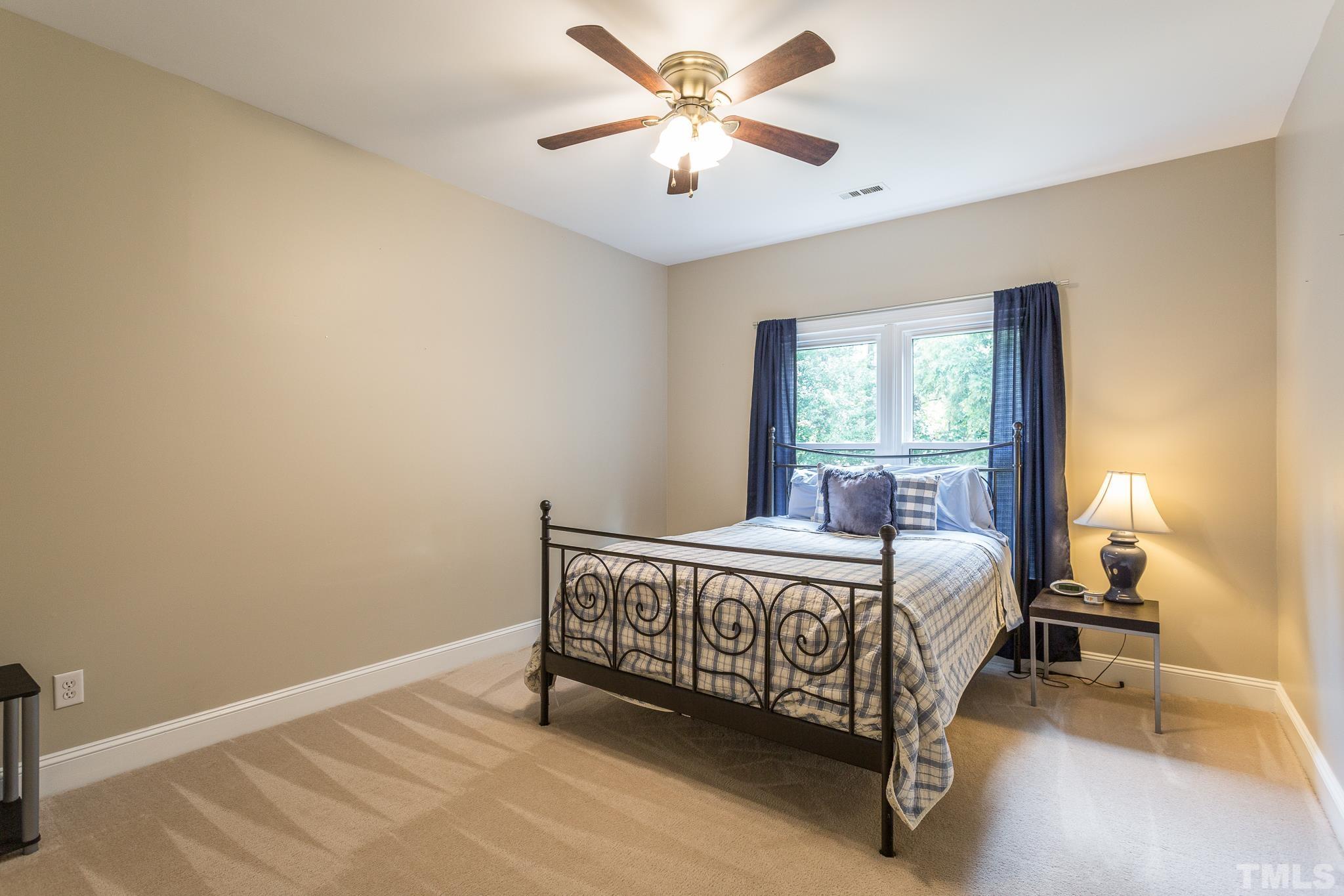 5225 Covington Bend Drive Raleigh, NC 27613 - Photo 25 of 30 a bed room with a bed and a window