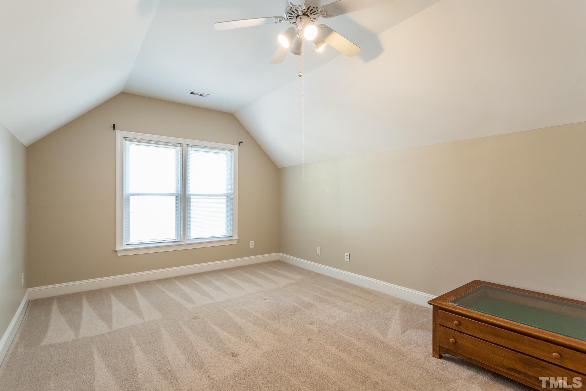 5225 Covington Bend Drive Raleigh, NC 27613 - Photo 26 of 30 an empty room with windows and fan