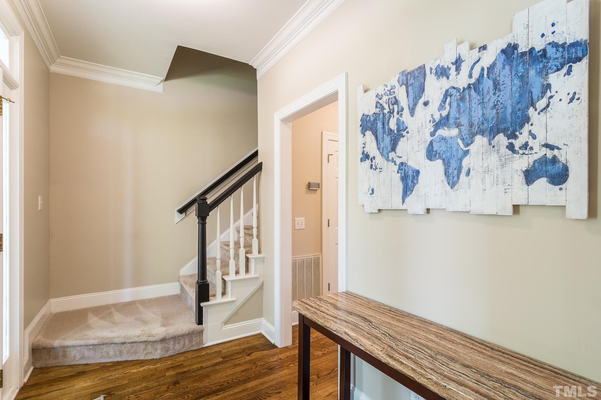5225 Covington Bend Drive Raleigh, NC 27613 - Photo 4 of 30 a view of a hallway with wooden floor and entryway