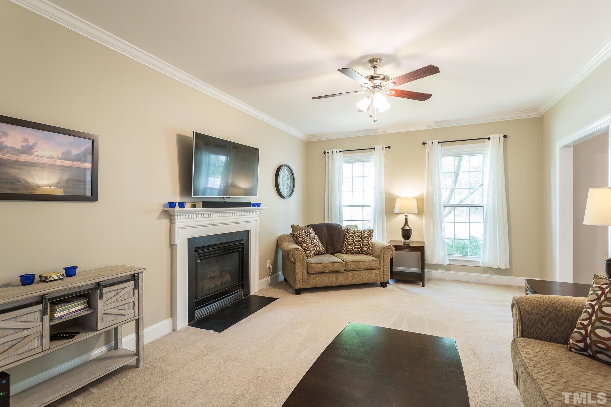5225 Covington Bend Drive Raleigh, NC 27613 - Photo 7 of 30 a living room with furniture and a fireplace